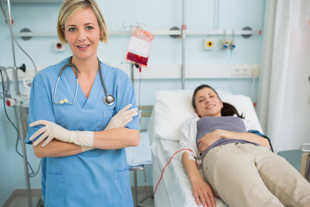 nurse standing female transfused patient (1)
